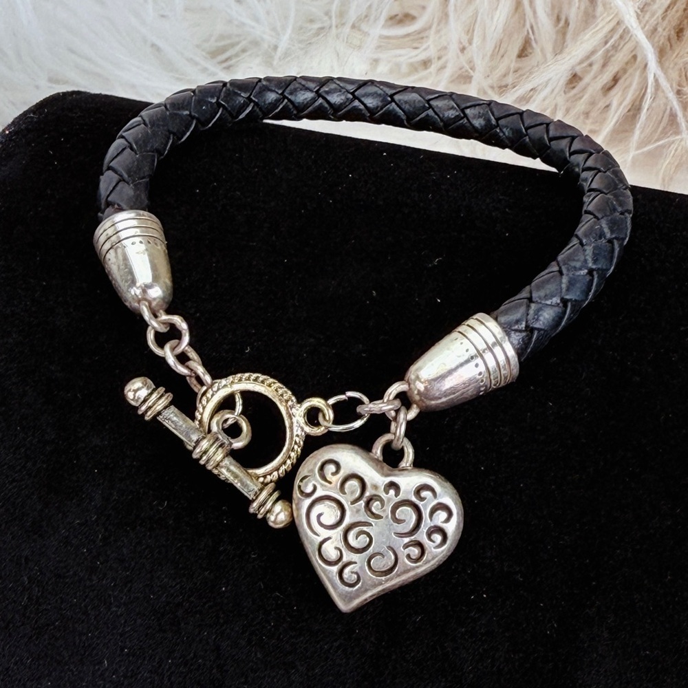 Silvertone etched heart, toggle closure, black woven band costume bracelet